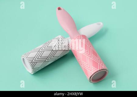 New lint rollers on color background Stock Photo