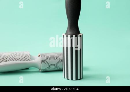 New lint rollers on color background Stock Photo
