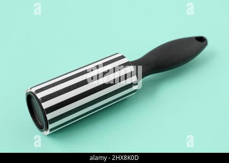 New lint roller on color background Stock Photo