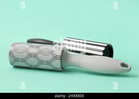 New lint rollers on color background Stock Photo