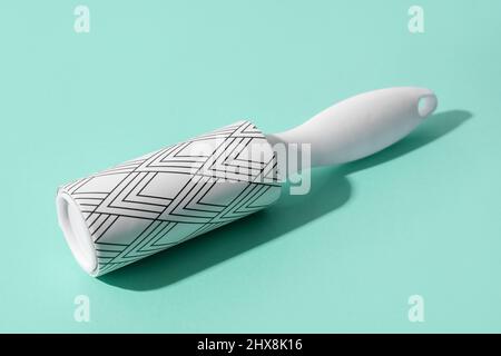 New lint roller on color background Stock Photo