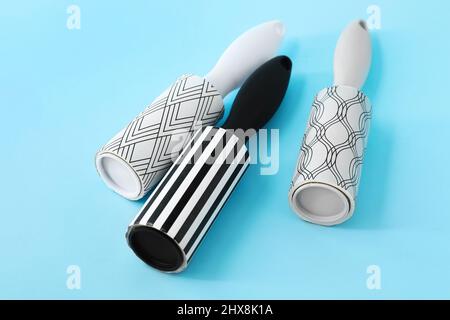 New lint rollers on blue background Stock Photo
