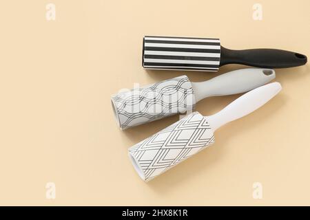 New lint rollers on beige background Stock Photo