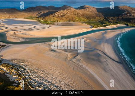 Not a soul in sight as aquamarine waters lap against this perfect white beach. Stock Photo