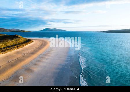 Not a soul in sight as aquamarine waters lap against this perfect white beach. Stock Photo