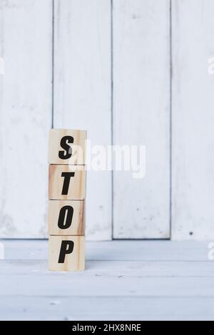 stop word or concept on wooden blocks, white wood background Stock Photo