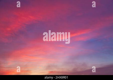 Background created from sky at sunset covered with red clouds. Stock Photo