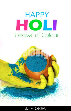 Yellow hand holding a pot filled with blue color Stock Photo