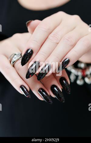 Woman Hand With Red Nails Buried in Black Sand stock photo | Fashion,  Commercial, Fine Art Stock Photo Archive