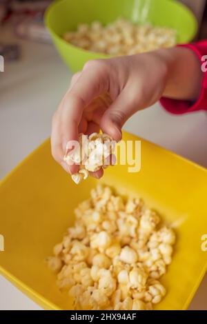 A bucket of popcorn, top-view, warm colors, daylight macro close-up, good time Stock Photo