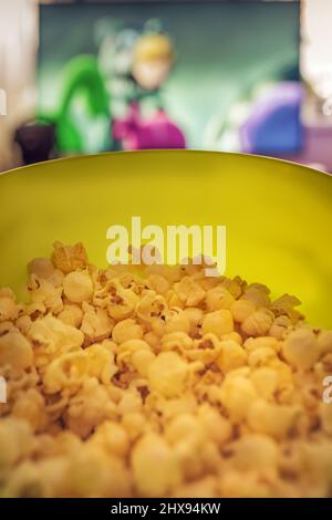 A bucket of popcorn, top-view, warm colors, daylight macro close-up, good time Stock Photo