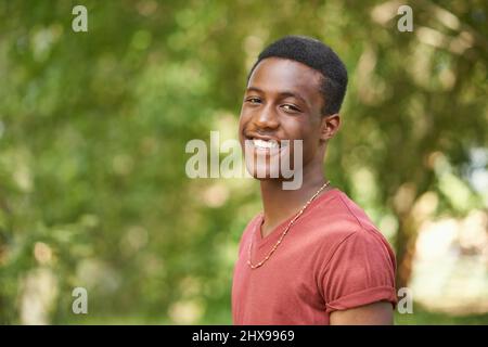 Just be yourself. Portrait of a handsome teenage boy standing in the outdoors. Stock Photo