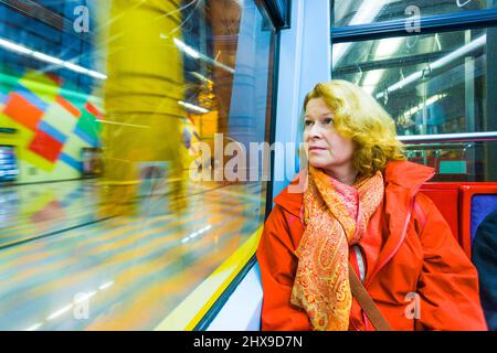 woman in subway by night Stock Photo