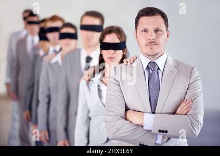 Blindfolded man standing in front of bull's eye Stock Photo - Alamy