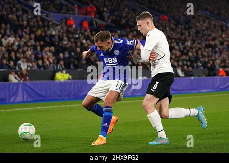 Leicester City's Marc Albrighton (left) and Rennes' Adrien Truffert battle for the ball during the UEFA Europa Conference League round of sixteen first leg match at the King Power Stadium, Leicester. Picture date: Thursday March 10, 2022. Stock Photo