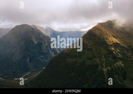 Fiordland New Zealand mountains in haze, Mount Elliot and Mount Pillans above Arthur Valley, Milford Track Stock Photo