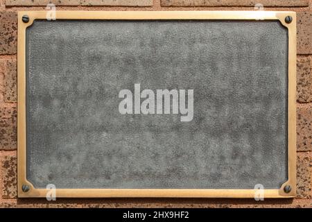 Blank Plaque on brick wall. Stock Photo