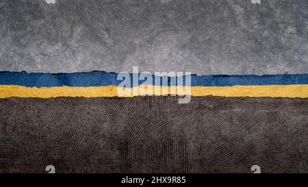 dark and gloomy landscape abstract with a narrow band of Ukraine blue and yellow colors. collection of handmade bark papers Stock Photo