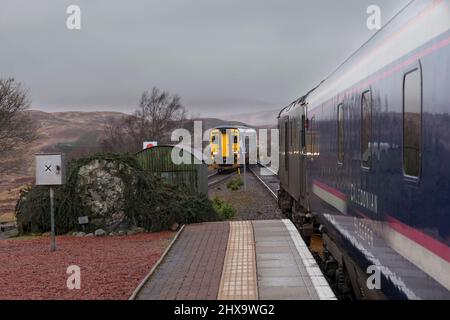 Caledonian sleeper train and Scotrail sprinter train crossing at Rannoch on the single track west highland railway line, Scotland, UK Stock Photo