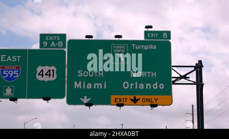 Direction signs to Miami on the highway - MIAMI, FLORIDA - FEBRUARY 14, 2022 Stock Photo