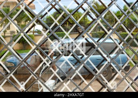 Close-up Reflection From Grilled Window Stock Photo