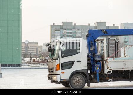 Portrait of a driver in the cabin of a truck driving Stock Photo