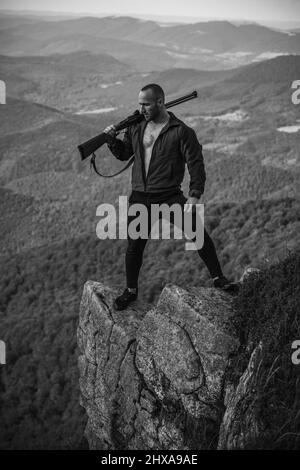 Young caucasian european hunter. American hunting rifles. Hunting without  borders. Hunter with shotgun gun on hunt. Portrait of handsome Hunter in  bro Stock Photo - Alamy