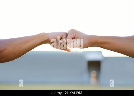 Youre my best bro. Cropped shot of two unrecognizable men bumping fists. Stock Photo