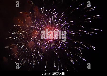 Bright lights of firework on black sky Stock Photo