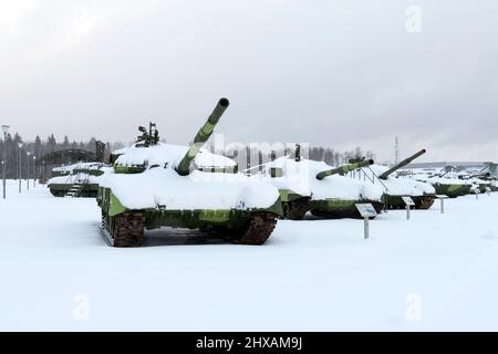 tanks on tracks and other various military equipment in the snow in winter Stock Photo