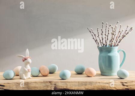 Easter eggs and spring flowers on a wooden table Stock Photo