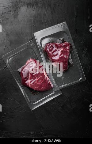 Beef rump steak pack set, on black dark stone table background, top ...