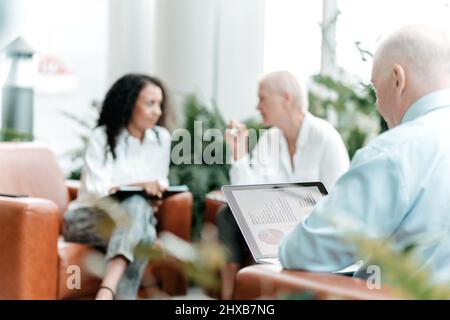 business man uses a laptop to check financial data . Stock Photo