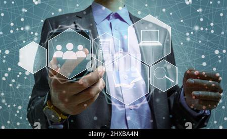 Internet and cybersecurity concept. A businessman is protecting personal data on mobile or smartphone. Online financial errands, data transfer Stock Photo