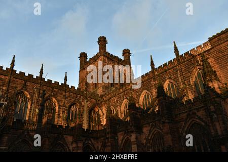 close up of Chester cathedral, the majestic tower glowing in the low sunshine at dusk Stock Photo