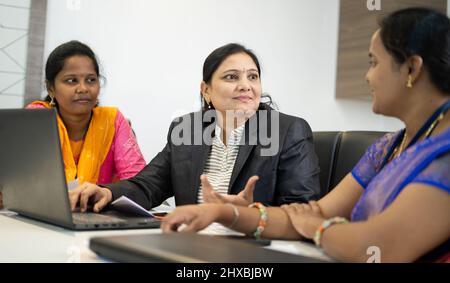 group of woman employees busy discussing during business meeting at office - concept of woman employment, empowerment, feminine and leadership Stock Photo