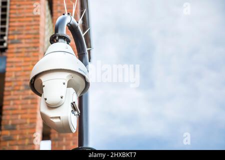 Avigilon surveillance camera in operation outdoors on UK building. Stock Photo