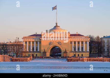 View of the left side of the old building of the Admiralty from the Neva river on a February sunny evening. Saint-Petersburg, Russia Stock Photo