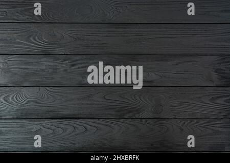 Black wooden background. Black textured wooden board. Stock Photo