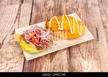 The stuffing of Stuffed Potatoes is made with a sauce with tomato, onion and garlic, in which the ground meat is cooked, with its dressings, the preco Stock Photo