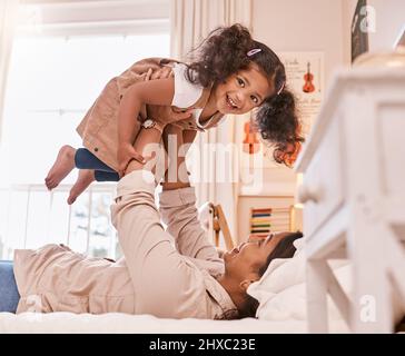 Ill always be here to lift you up. Shot of a little girl playing with her mother at home. Stock Photo