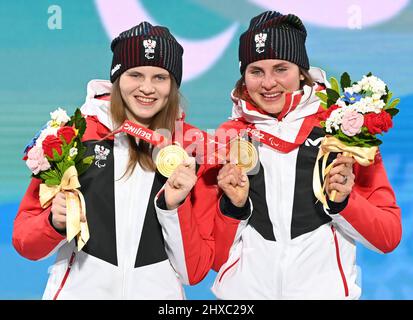 Veronika Aigner of Austria and guide Elisabeth Aigner celebrate