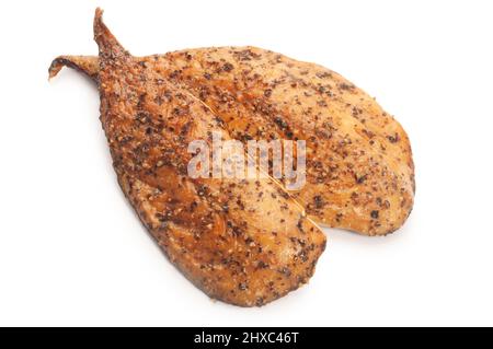 Studio shot of hot smoked, peppered mackerel fillets cut out against a white background - John Gollop Stock Photo