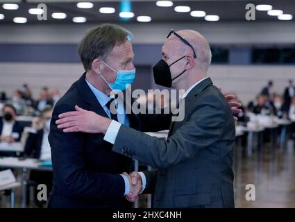 Bonn, Germany. 11th Mar, 2022. Hans-Joachim Watzke (l), DFB Vice President, congratulates Bernd Neuendorf on his election as the new president of the German Football Association. The 60-year-old prevailed over candidate Peters in the election held during the DFB's national convention in Bonn on Friday. Credit: Ronald Wittek/EPA-Pool/dpa/Alamy Live News Stock Photo