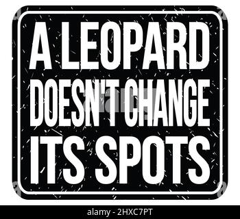 A LEOPARD DOESN'T CHANGE ITS SPOTS, text written on black stamp sign Stock Photo