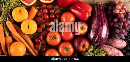 Panoramic shot of various fruits and vegetables on table Stock Photo