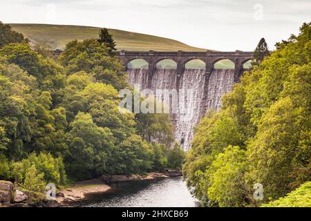 Craig Goch dam and aquaduct overflowing to river Elan below Stock Photo