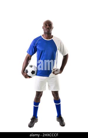 Full length portrait of confident male african american athlete with soccer ball on white background Stock Photo