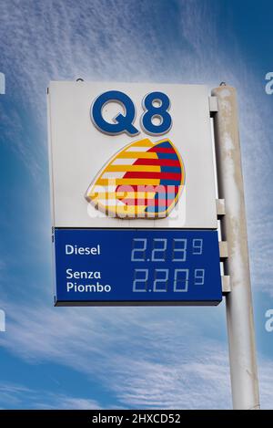 Fossano, Italy - March 11, 2022: Q8 logo sign with euro fuel prices display with high values for oil price increase, gas station of Kuwait Petroleum I Stock Photo