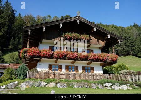 Germany, Bavaria, Upper Bavaria, Traunstein district, detached Bavarian country house, wooden balconies,  lush floral decoration Stock Photo
